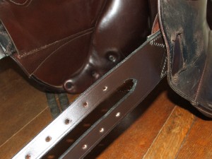 New English leather handmade long girth straps on dressage saddle