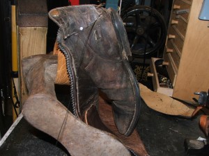 Flap handstitched onto boot and New Zip handstitched in